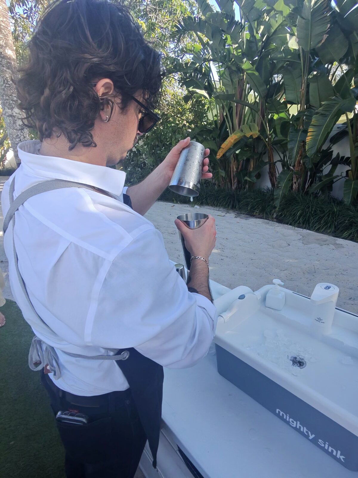 Bartender pouring drinks at the mobile bar station during an event