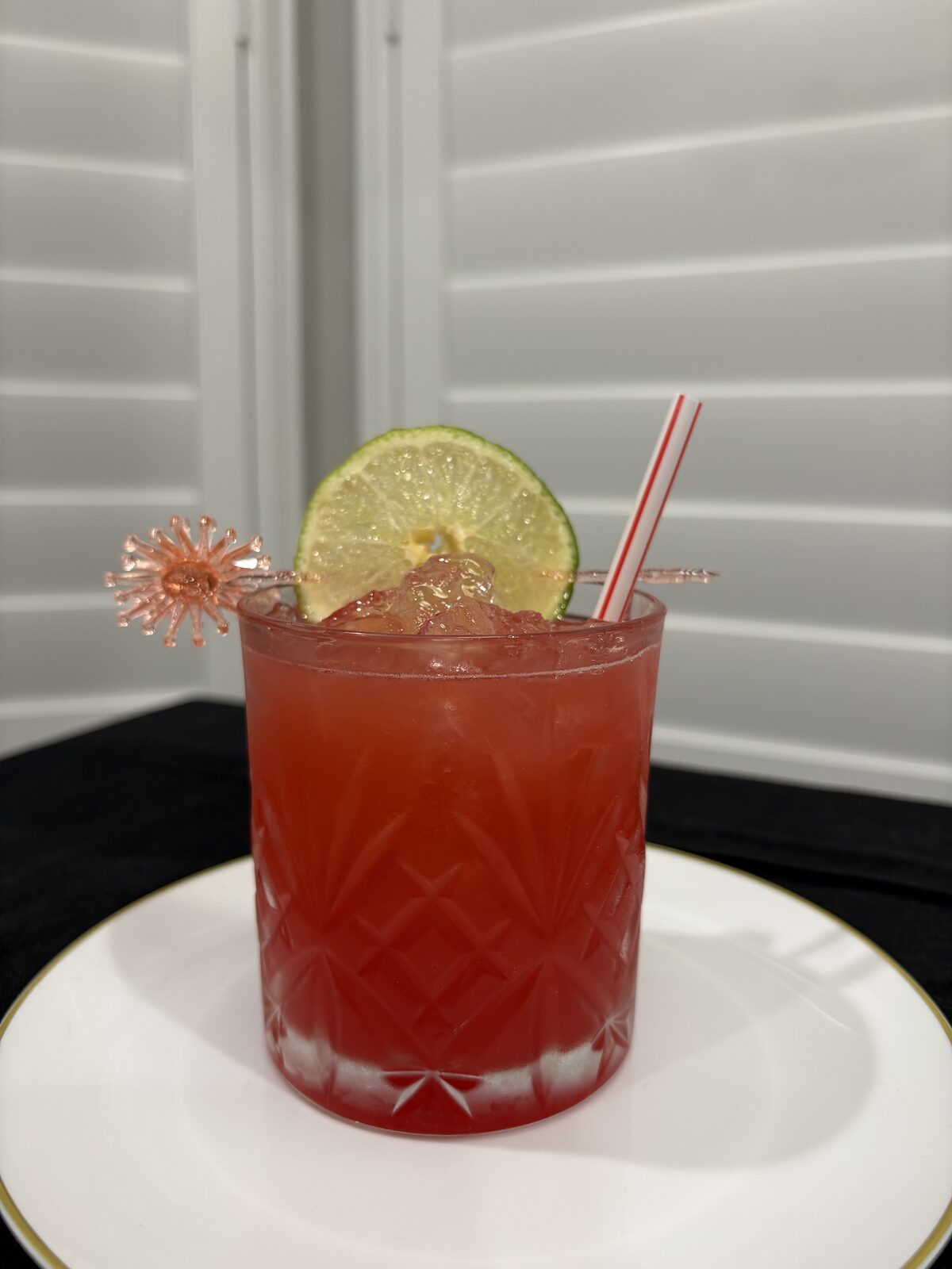 Signature cocktail garnished with lime, ready to serve
