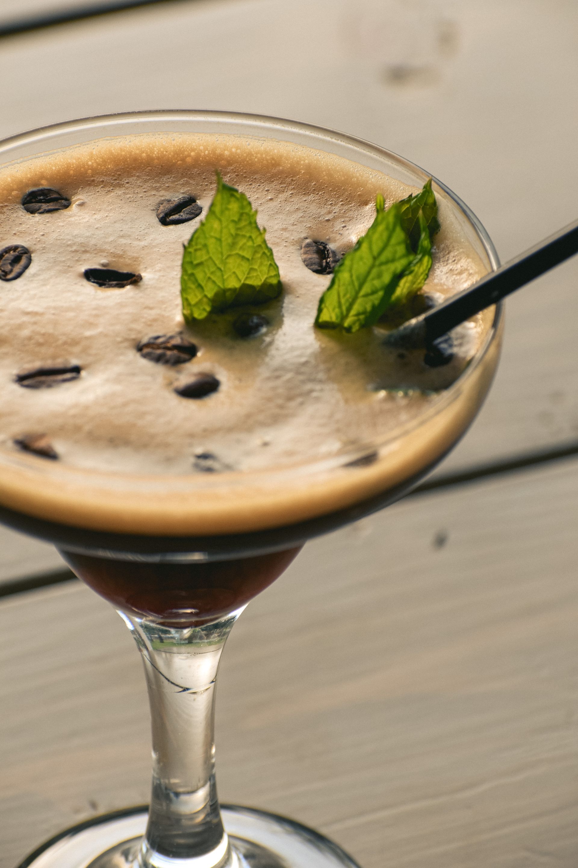 Caffeine and Kisses espresso cocktail topped with mint and coffee beans