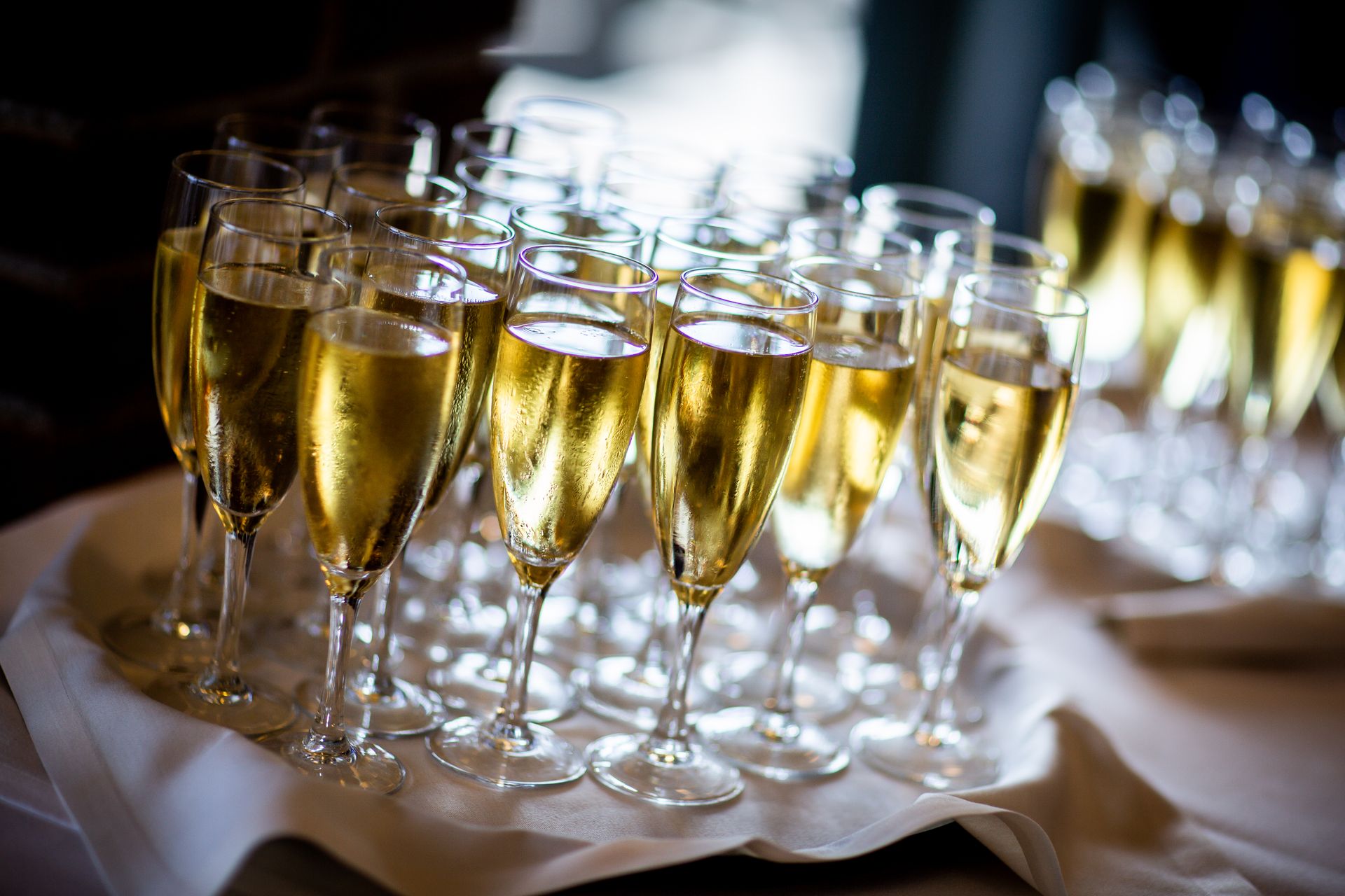 Rows of filled champagne flutes ready for a wedding toast at a Palm Beach County reception